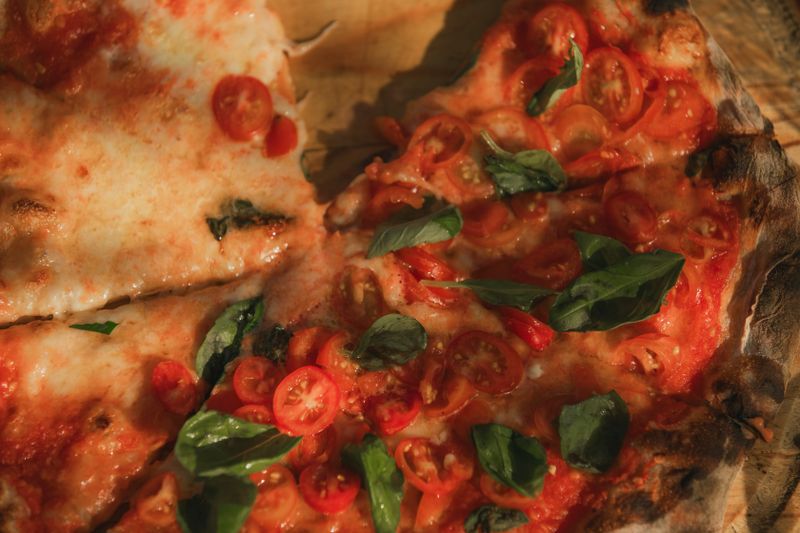 Margherita pizza with fresh basil and mozzarella