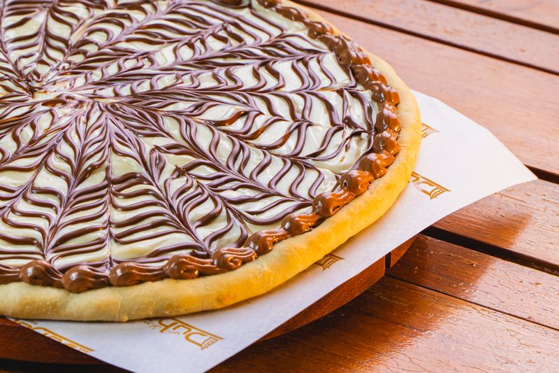 Nutella pizza dessert with strawberries