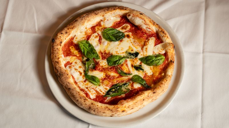 BBQ Chicken pizza with smoky sauce and fresh herbs